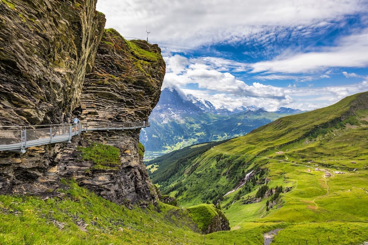 View of Grindelwald First. Popular tourist attraction cliff walk at the Grindelwald First. Swiss alps, Grindelwald valley, Switzerland. First cliff walk in Grindelwald, Switzerland.